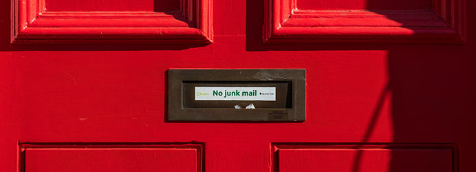 Red door with No Junk Mail sign