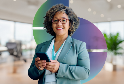 A business woman smiling with phone in hand