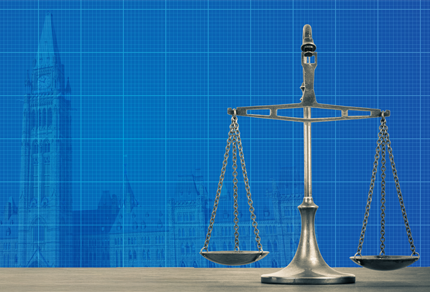 Scales of justce and the parliament buildings