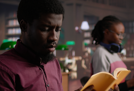 A man reads a book in a law library