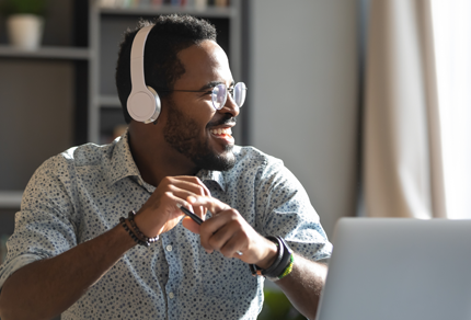 A man listens to a podcast on his headphones.