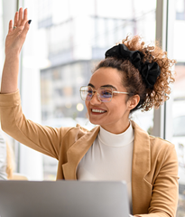 A woman raises her hand